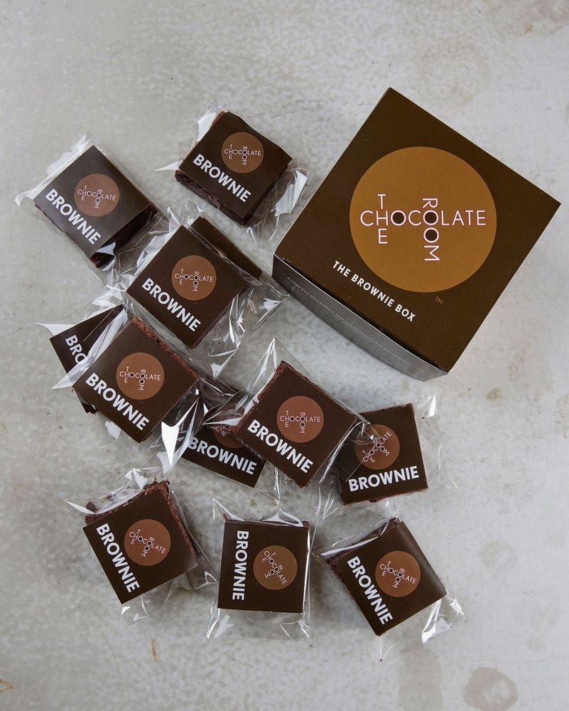 12 individually packaged brownies surrounding a branded The Brownie Box - there's enough to share!