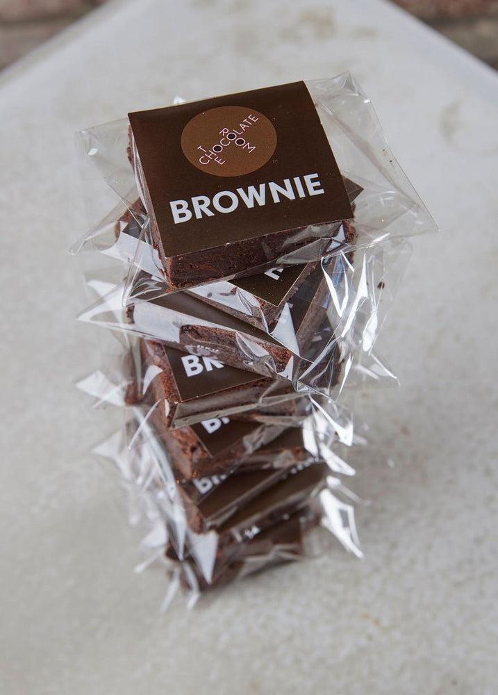 A stack of 12 individually packaged rich and delicious brownies